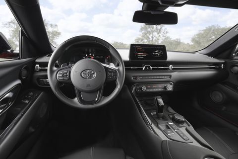 Inside the 2020 Toyota Supra. Unlike its predecessors, the new Supra trades a 2+2 layout for a two-seat configuration. The car gets an eight-speed automatic transmission that can be operated with shifter paddles.