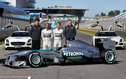 Mercedes' Toto Wolff, Lewis Hamilton, Nico Rosberg and Ross Brawn show off the W04.