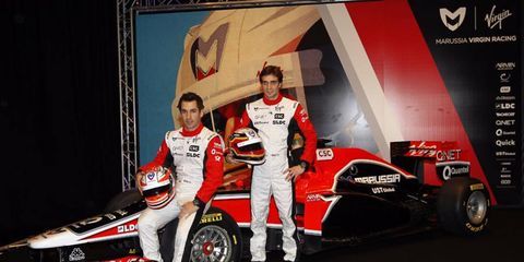 Timo Glock and Jerome d'Ambrosio stand next to the new MVR-02
