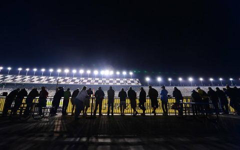 AH, NIGHT RACING // Fans watch practice for the Sprint Unlimited at the Daytona International Speedway. The Sprint Unlimited race&#8212;formerly the Bud Shootout&#8212;is for 2012 Cup pole winners as well as drivers who have won previous Daytona 500s. Photo by: ASP/Cal Sport Media/ZUMAPRESS.com