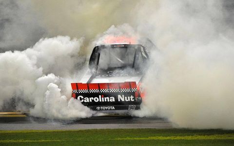 Johnny Sauter does the celebratory burnout in front of the fans at Daytona on Friday night.