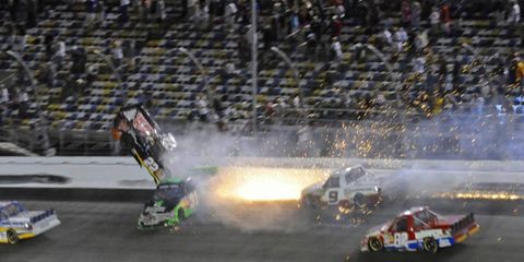 SCARY FLIGHT: Joey Coulter (No. 22) goes airborne on the final lap of the NASCAR Camping World Truck Series race on Feb. 24 at Daytona after contact with James Buescher (No. 31). Coulter was not injured.