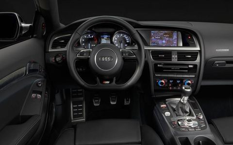 The interior of the 2013 Audi S5 coupe has had subtle changes from previous models, with the addition of a new gauge cluster and steering wheel.