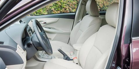 The Toyota Corolla LE interior adds a navigation, Toyota&#8217;s Entune multimedia system, power and heated beige leather-trimmed seats and special-edition floor mats.