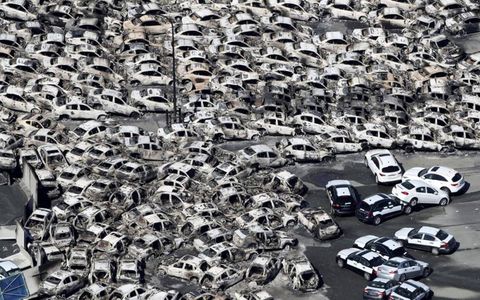 SEA OF DISCONTENT // Nissan and Infiniti vehicles were washed away by the tsunami at Hitachinaka, Japan, on March 11. The 9.0-magnitude earthquake north of Tokyo triggered fires and a tsunami. Photo by: The Yomiuri Shimbun/AP Images