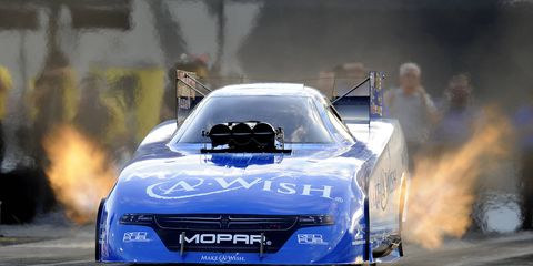 Funny Car driver Tommy Johnson Jr. set a track record en route to the provisional top in NHRA qualifying at Charlotte.