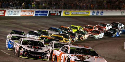 Chase Elliott leads a pack during the Monster Energy NASCAR Cup Series Federated Auto Parts 400 at Richmond Raceway.