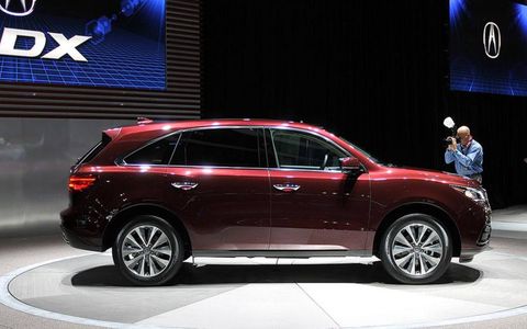 The 2014 Acura MDX gets massaged sheetmetal, new safety and technology features and a front-wheel-drive version for the first time.