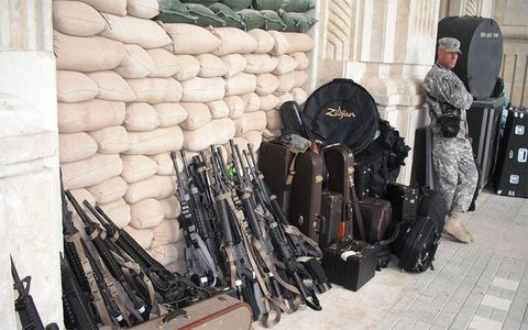 Weapons and music, a curious combination--but part of daily life in the Middle East.