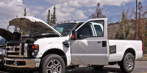 The F-350 is spied with doors and hood open.