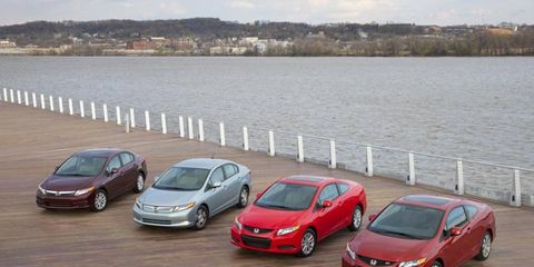 The 2012 Honda Civic family of cars. From left to right: The Civic EX-L, the Civic Hybrid, the Civic EX coupe and the Civic Si coupe