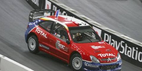 WRC titlist Sebastien Loeb exacted revenge on 2004 winner Heikki Kovalainen on his way to overall victory.