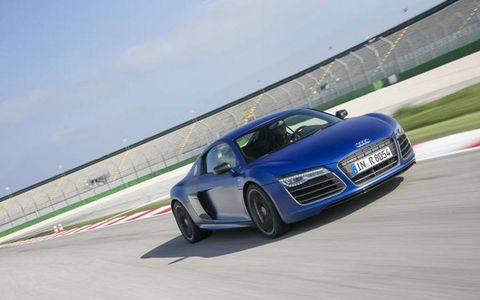 We did not drive this on a race track, as the photo suggests, but that is the 2014 Audi R8 V10 plus Coupe Quattro S tronic in Sepang Blue matte effect paint -- same as ours.