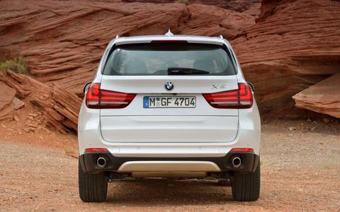 The new BMW X5 retains its upright profile and traditional features such as its two piece tailgate.
