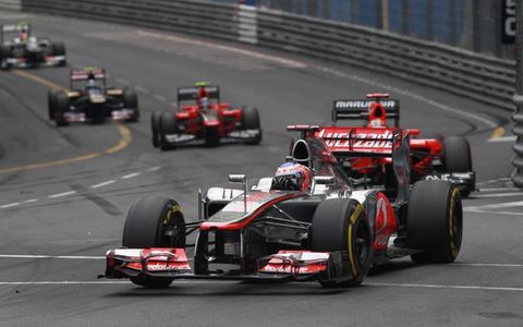 2012 Monaco Grand Prix: Jenson Button, McLaren MP4-27 Mercedes, leads Timo Glock, Marussia MR01 Cosworth, and Charles Pic, Marussia MR01 Cosworth.