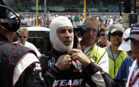 Helio Castroneves suits up.