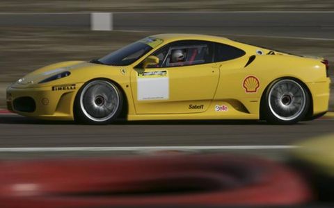 While the F430 Challenge has the same 4.3-liter, 490-hp V8 as the base F430, numerous racing-intent modifications are made. Changes include carbon-ceramic brakes (a Ferrari Challenge car first), 19-inch Pirelli slicks mounted on center locking rims, a Lexan windscreen, six-point racing harness and FIA-compliant roll cage, gearbox tuning that reduces fifth and sixth gear final-drive ratios and quickens overall shifts, a carbon fiber intake manifold; and a reworked exhaust that lightens the pipes and moves them to a rear-center position. The weight-saving efforts shave roughly 225 pounds off the 3196-pound street car.