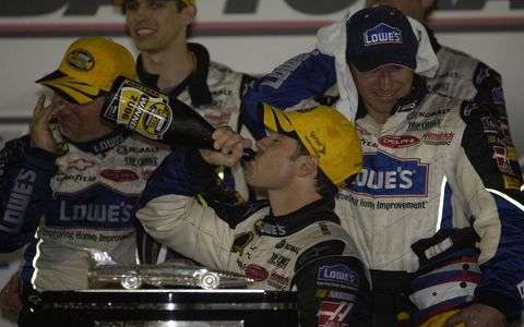 Daytona 500 - Jimmy Johnson enjoys some winning champagne