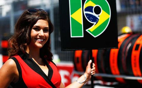 Grid girls in Montreal played a key role in getting drivers to their cars before the Formula One race.