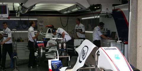 The BMW-Sauber F1 readies Nick Heidfeld's car for the race.