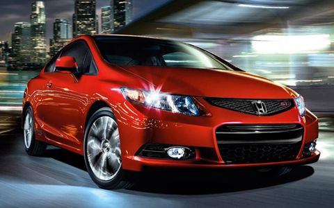 The 2013 Honda Civic Si Coupe  handles well on the track.