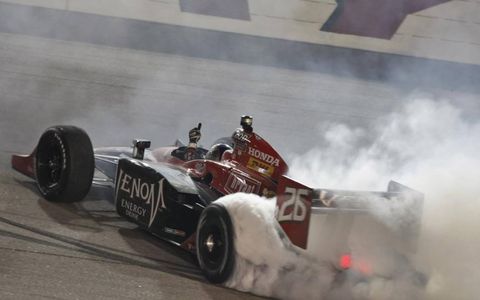 Marco Andretti celebrates with some burn outs. Photo by: Phillip Abbott/LAT Photographic