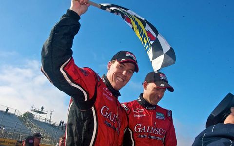 Alex Gurney (left) and Jon Fogarty (right) celebrate their Grand-Am win at Laguna Seca on July 9. Photo by: R.D. Ethan/LAT Photographic