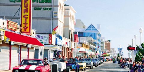 Cars drive down the boardwalk in Ocean City, MD., one of the largest mid-Atlantic seaside resorts.