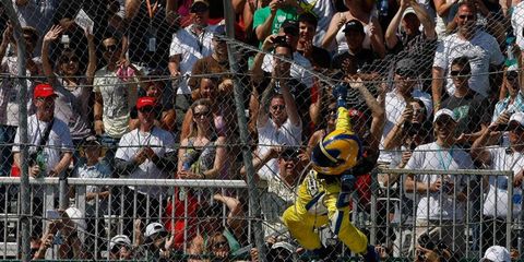 Helio Castroneves did his Spiderman routine after his win on Sunday in Edmonton.