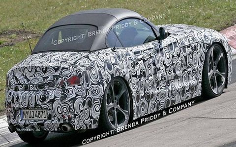 Groovy! It's BMW's new Z4 with its new folding hardtop artfully hidden under some fabric.
