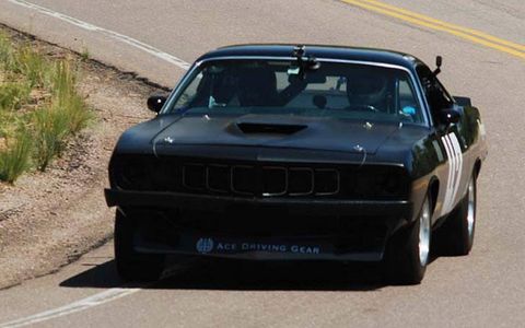 The  black Barracuda of Jess Neal took the Vintage Automobile Division at Pikes Peak with a time of 12:03.858, more than 23 seconds quicker than the nearest rival.