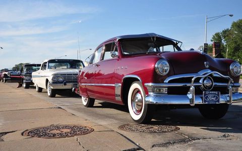 A 1950 Ford heads one lineup of classics parked on Woodward on Friday evening