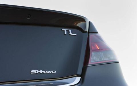 The emblem of the 2013 Acura TL SH-AWD