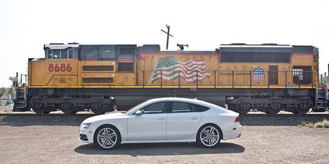 Audi S7 in front of a fine General Motors product: EMD SD70ACe locomotive.