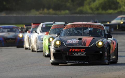The No. 30 NGT Motorsports 911 GT3 Cup leads a line of cars around Road America. Photo by: Dan R. Boyd/LAT Photographic