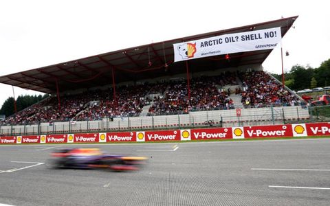 Protesters hung a banner on main grandstand in Belgium on Sunday in protest of race sponsor Shell's drilling practices in the Arctic.