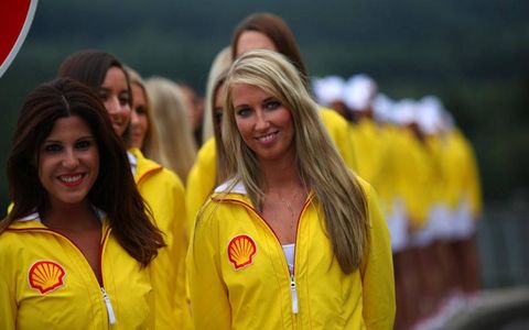 The grid girls in Belgium have a way of making work look like fun.