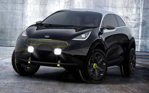 The Kia Niro is accented in stainless steel and yellow.