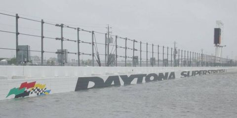 Water covers a portion of the track at the Daytona International Speedway after heavy rains.
