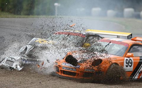 Playing in the Dirt//Steve Parish and Keith Webster arrive together in a sand trap at Knockhill (Scotland) during the running of the Porsche Carrera Cup.