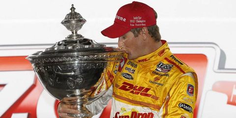 Ryan Hunter-Reay holds his championship trophy after Saturday's race.