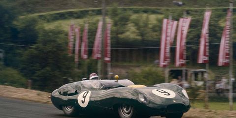 A sleek Lister-Jaguar tackles the N&uuml;rburgring in 1959.