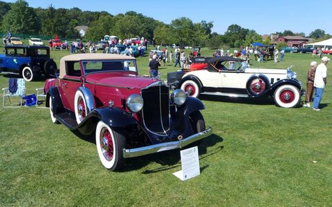 A 1932 Packard 900 coupe sits next to the white 1930 Packard 740 roadster belonging to Margaret Dunning of Plymouth, Mich.