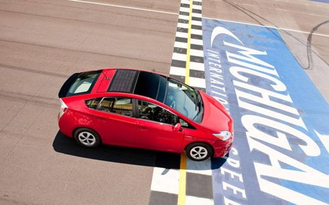 The 2012 Toyota Prius Four crosses the finish line for testing at Michigan International Speedway.