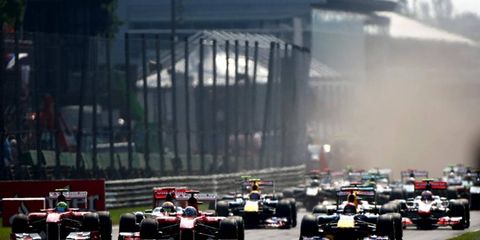 Autodromo Nazionale di Monza, Monza, Italy: Fernando Alonso Ferrari, Sebastian Vettel Red Bull Racing, Lewis Hamilton, McLaren  lead the field in to the first corner.