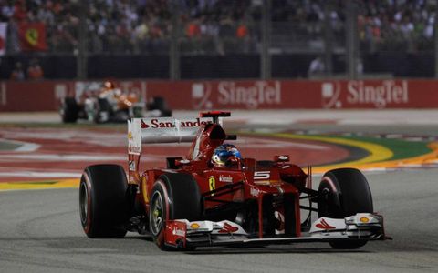 Points leader Fernando Alonso finished third under the lights on Sunday.