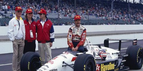 Team owners Paul Newman (left) and Carl Hass, with driver Nigel Mansell and his car prior to the 1993 Indianapolis 500. Mansell, in his rookie season in the series, finished third in the race.