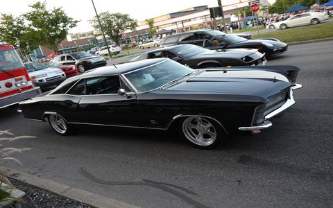 A classic Buick Riviera lines up with a Chevy Camaro and Porsche.