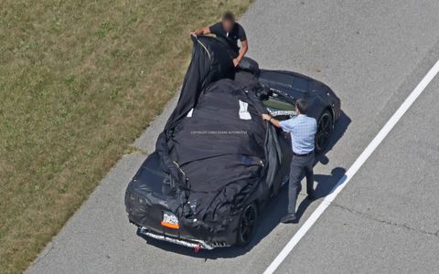 These new spy shots of the mid-engine Corvette show even more detail than before, even as the engineers quickly cover it up after noticing they've been spotted.