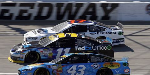 Aric Almirola (43) led the first Chase race with less than 40 laps to go before a blown engine sent him to the sidelines in 41st place.